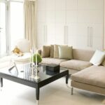 Three seat boucle sofa against a warm wall